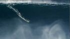 Kelly Slater and Joel Parkinson surfing big waves in Praia do Norte Nazare