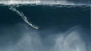 Kelly Slater and Joel Parkinson surfing big waves in Praia do Norte Nazare